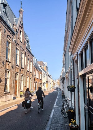 couple cycling in city